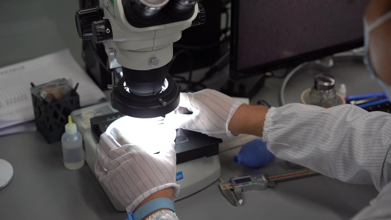High-magnification microscope inspection of electronic components at partner testing lab